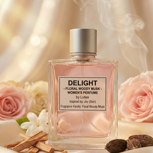 Perfume bottle labeled 'Delight' by Lutea with flowers and spices on a soft background